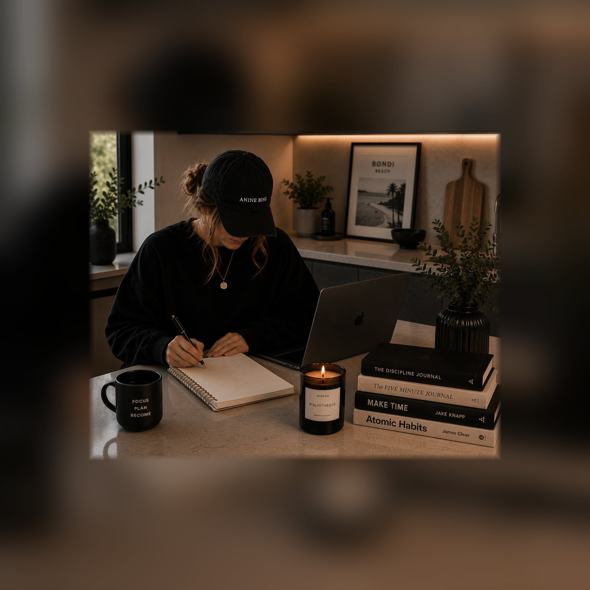 The Becoming Bundle guides on a tablet — kitchen bench black and white lifestyle mockup, full-bleed square