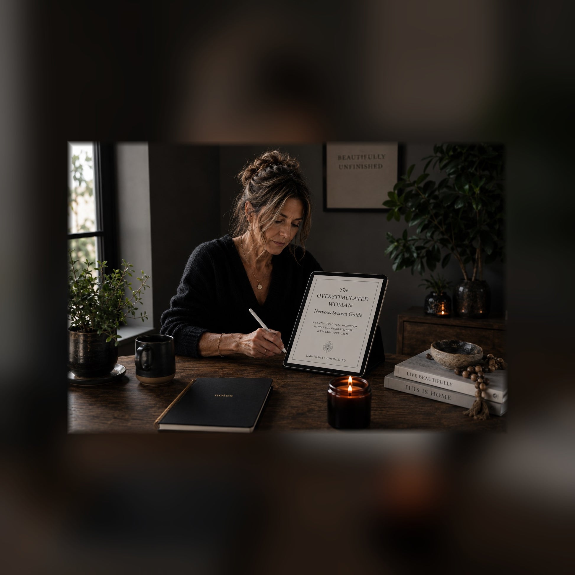 The Overstimulated Woman nervous system guide on a tablet — black and white lifestyle mockup 1, full-bleed square