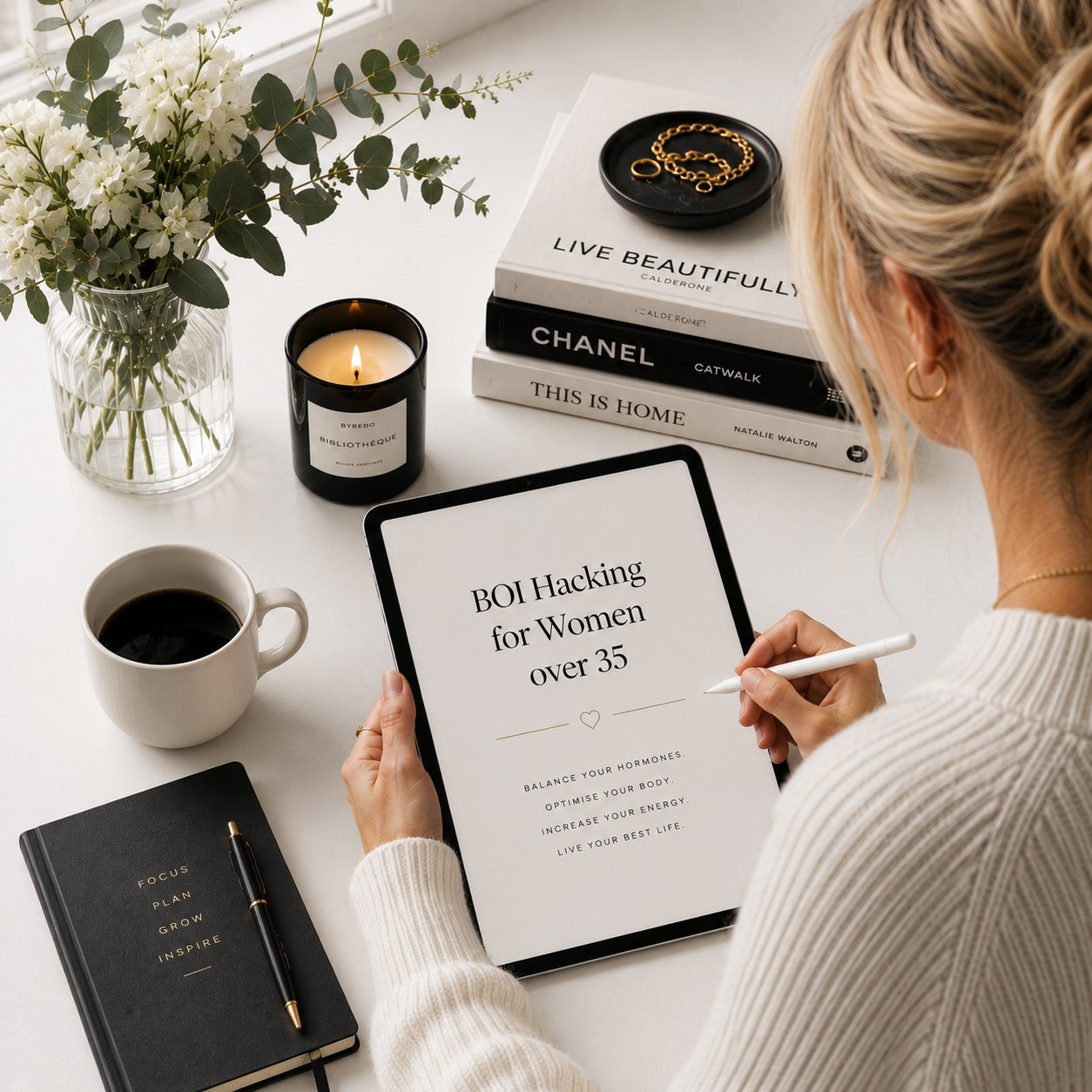 Woman reading Biohacking for Women Over 35 digital guide — light monochrome lifestyle mockup