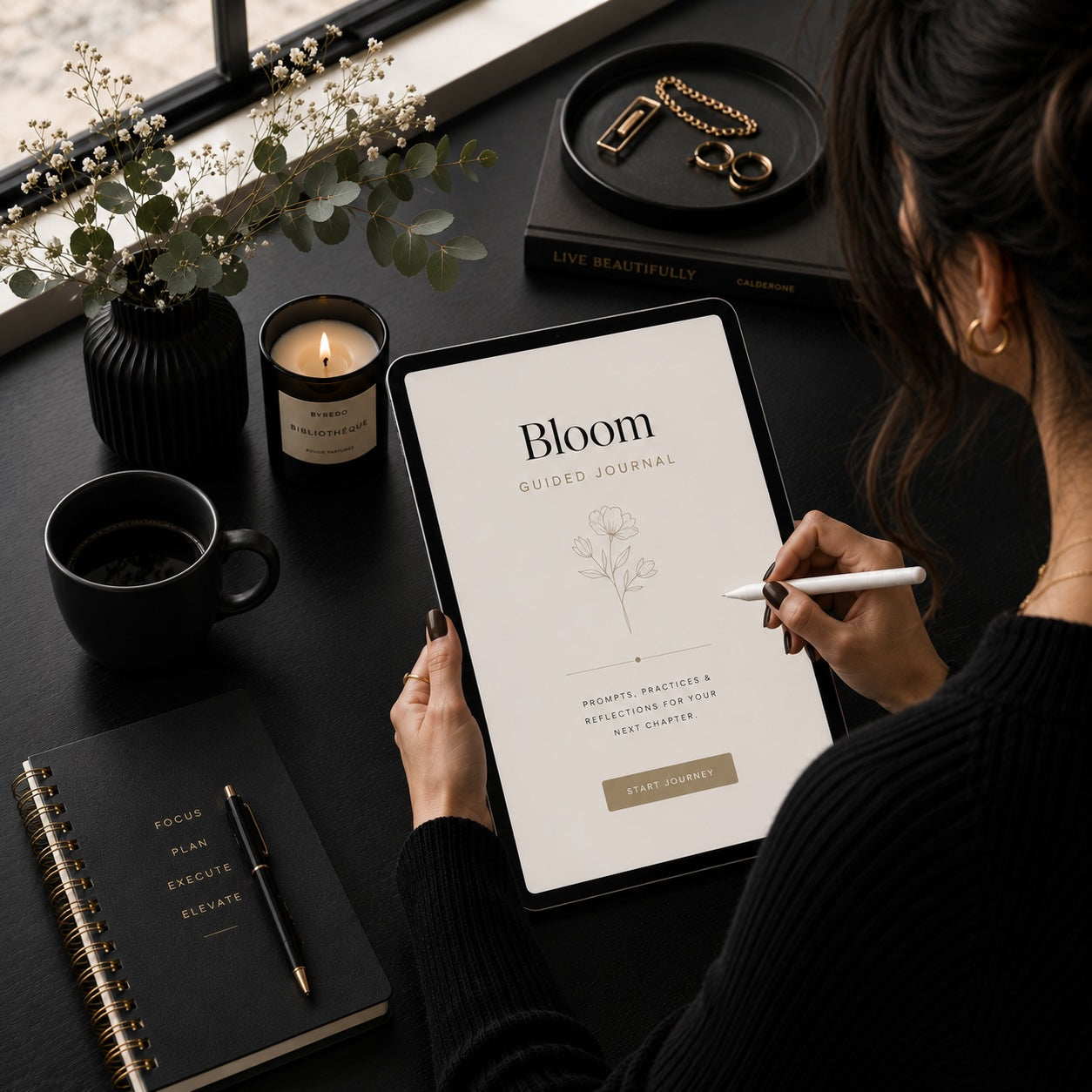 Woman starting the Bloom gratitude journal on a tablet — evening wind-down lifestyle scene