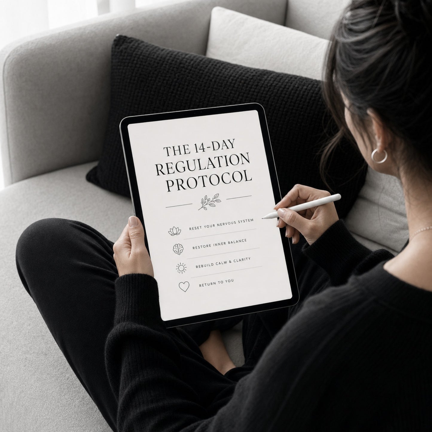 Woman using The 14-Day Regulation Protocol nervous system guide — sofa lifestyle mockup
