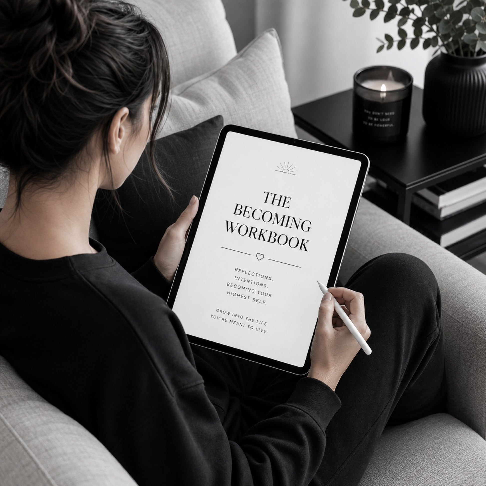 Woman reading The Becoming Workbook identity change guide — sofa lifestyle mockup