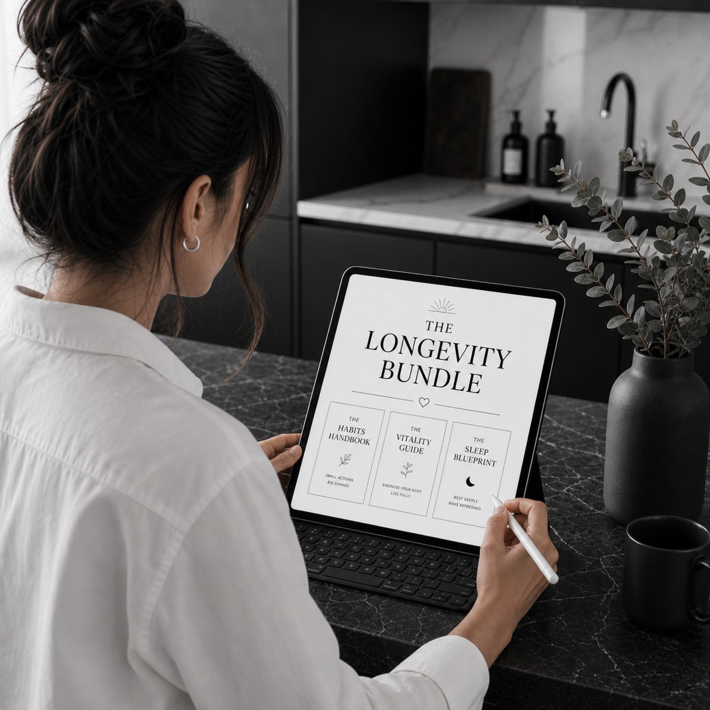 The Longevity Bundle three-workbook digital set — kitchen lifestyle mockup