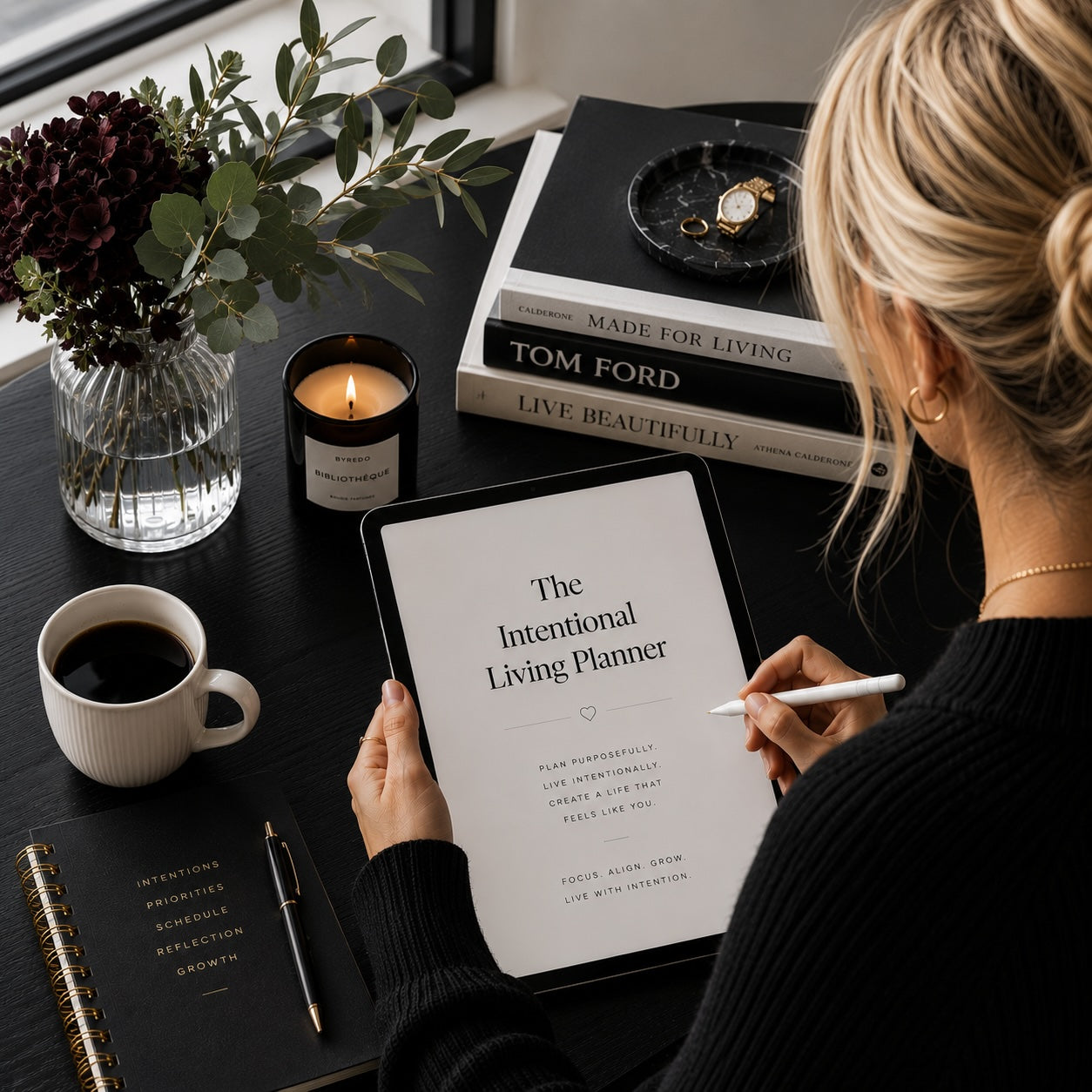Woman planning with The Intentional Living Planner — monochrome desk lifestyle mockup 2